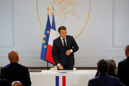 French President Emmanuel Macron arrives to attend a news conference to unveil his policy response to the yellow vests protest, at the Elysee Palace in Paris, France, April 25, 2019. REUTERS/Philippe Wojazer