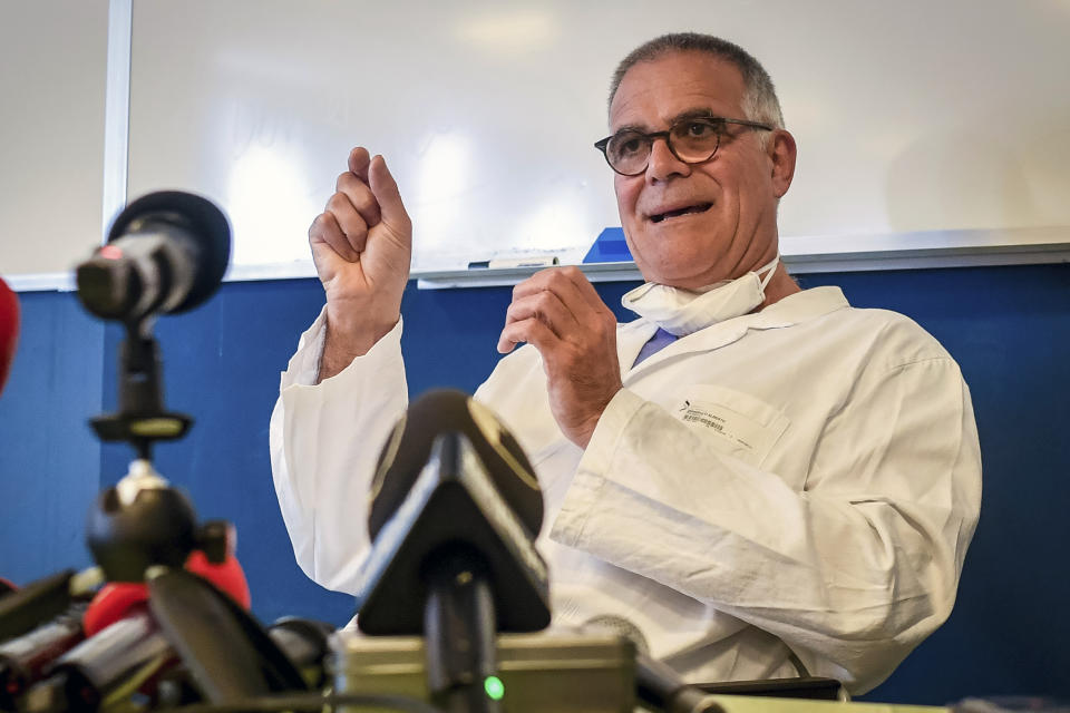 Alberto Zangrillo, Silvio Berlusconi's longtime physician, talks to reporters at the San Raffaele hospital in Milan, Friday, Sept. 4, 2020. Former Premier Silvio Berlusconi, who tested positive for COVID-19 this week, has an early-stage lung infection but was breathing on his own Friday after being hospitalized in Milan, his personal physician said. Alberto Zangrillo, who is also on the staff of San Raffaele hospital, where Berlusconi was taken in the early hours of the day, told reporters that test results are reassuring and “makes us optimistic” for his recovery over the next “hours and days.” (Claudio Furlan/LaPresse via AP)