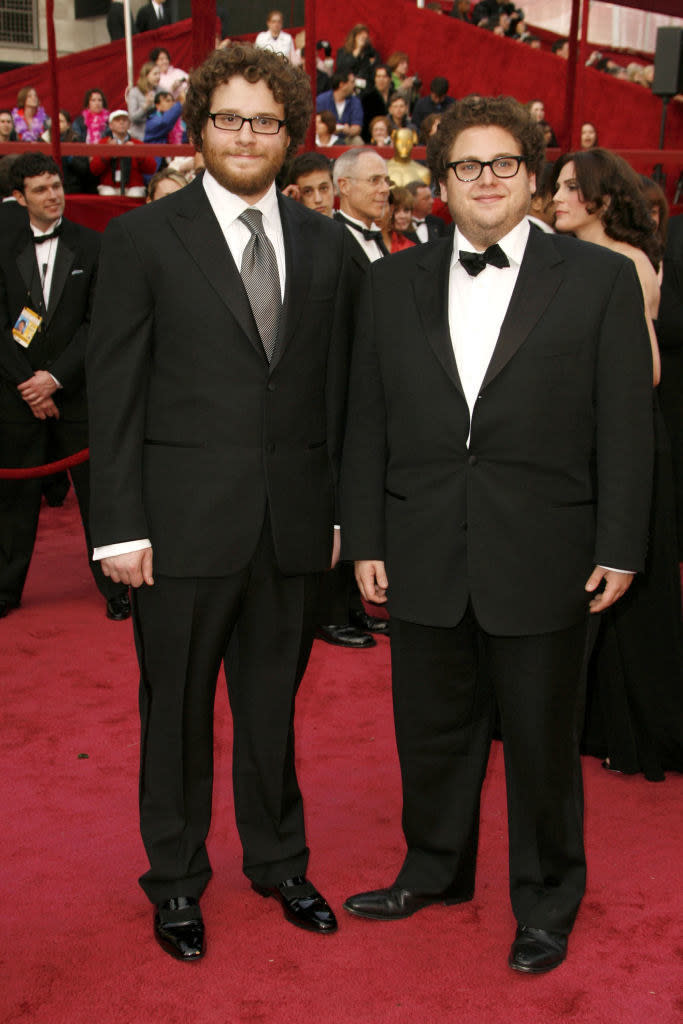Seth with Jonah Hill on the red carpet in a suit