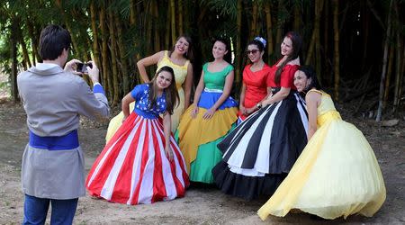 Descendants of American Southerners wearing Confederate-era dresses and uniforms take a photograph during a party to celebrate the 150th anniversary of the end of the American Civil War in Santa Barbara D'Oeste, Brazil, April 26, 2015. REUTERS/Paulo Whitaker