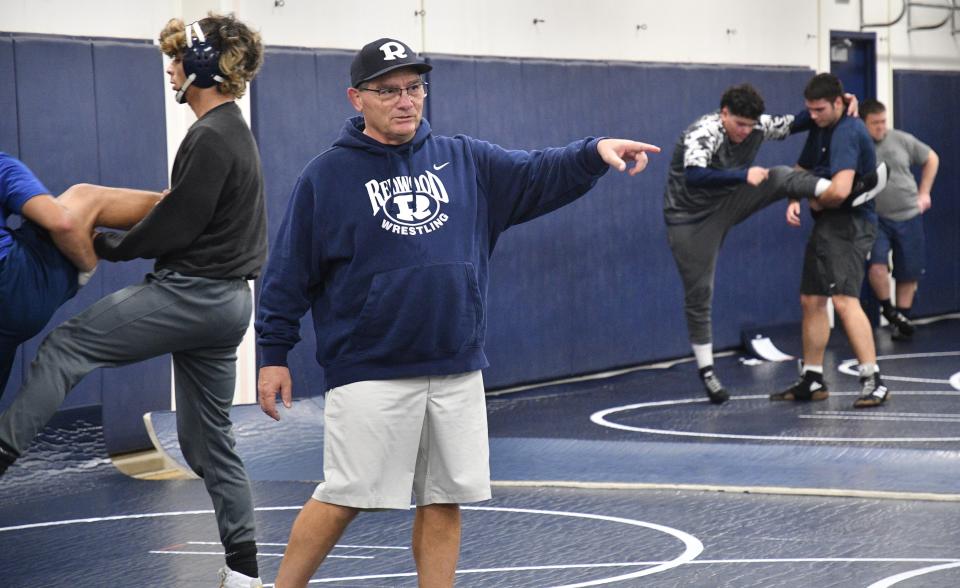 Redwood High School wrestling coach Dave Watts directs a practice on Feb. 7, 2024 in Visalia.