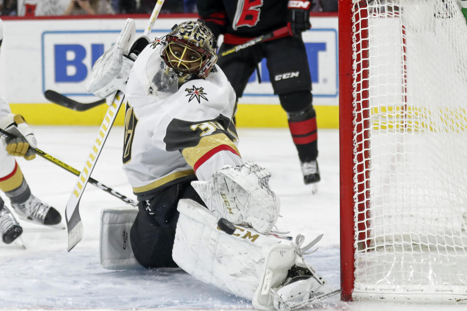 Vegas Golden Knights goaltender Malcolm Subban stops a shot during the second period of the team's NHL hockey game against the Carolina Hurricanes in Raleigh, N.C., Friday, Jan. 31, 2020. (AP Photo/Gerry Broome)
