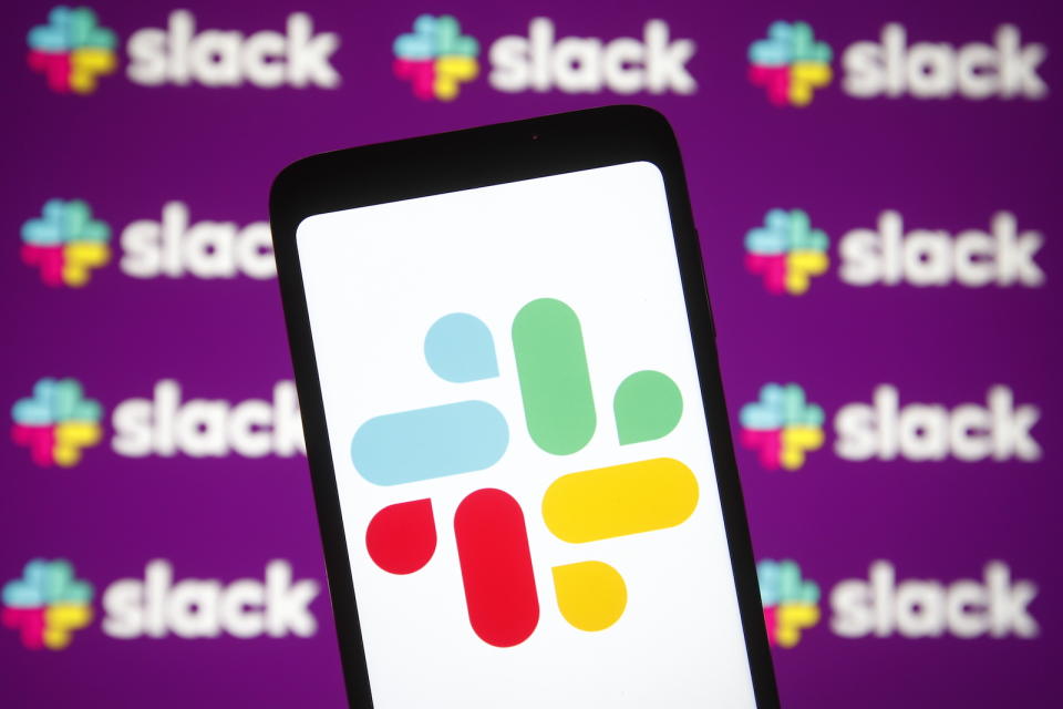 A logo of chat app, Slack, on a phone.