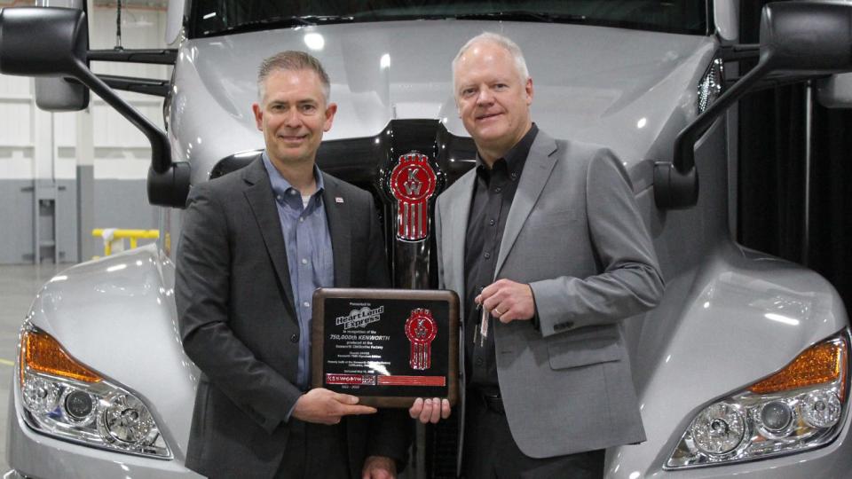 Heartland Express’ CEO Mike Gerdin received the keys to the historic truck from Kevin Baney, Kenworth general manager and PACCAR vice president.