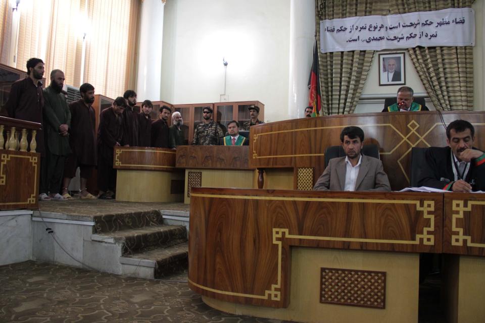 Defendants stand trial in the Primary Court in Kabul, Afghanistan in May 2015.