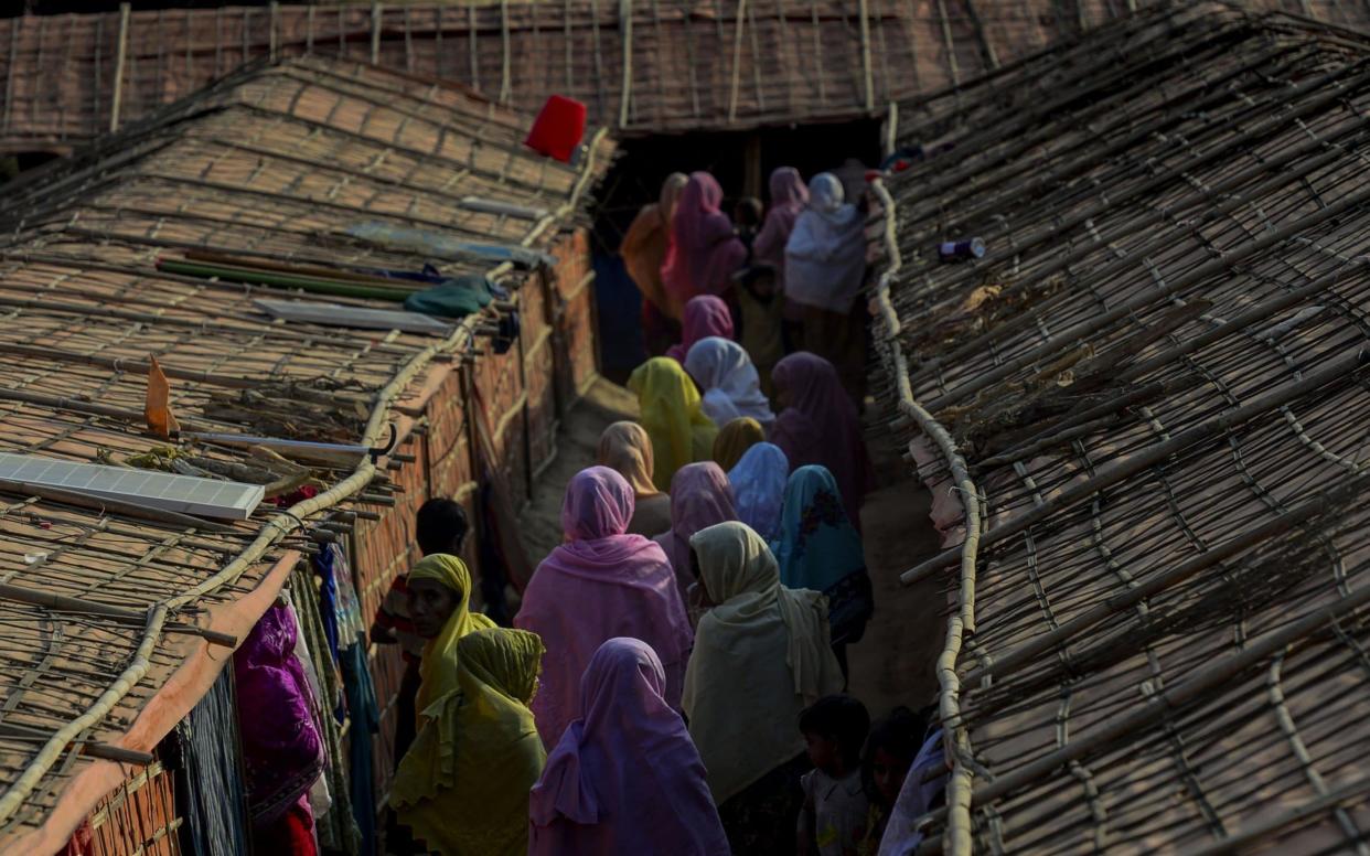 Rohingya women walking inside the