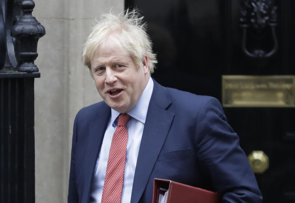 Britain's Prime Minister Boris Johnson leaves 10 Downing Street to attend the weekley session of Prime Ministers Questions in Parliament in London, Wednesday, Jan. 22, 2020. (AP Photo/Kirsty Wigglesworth)