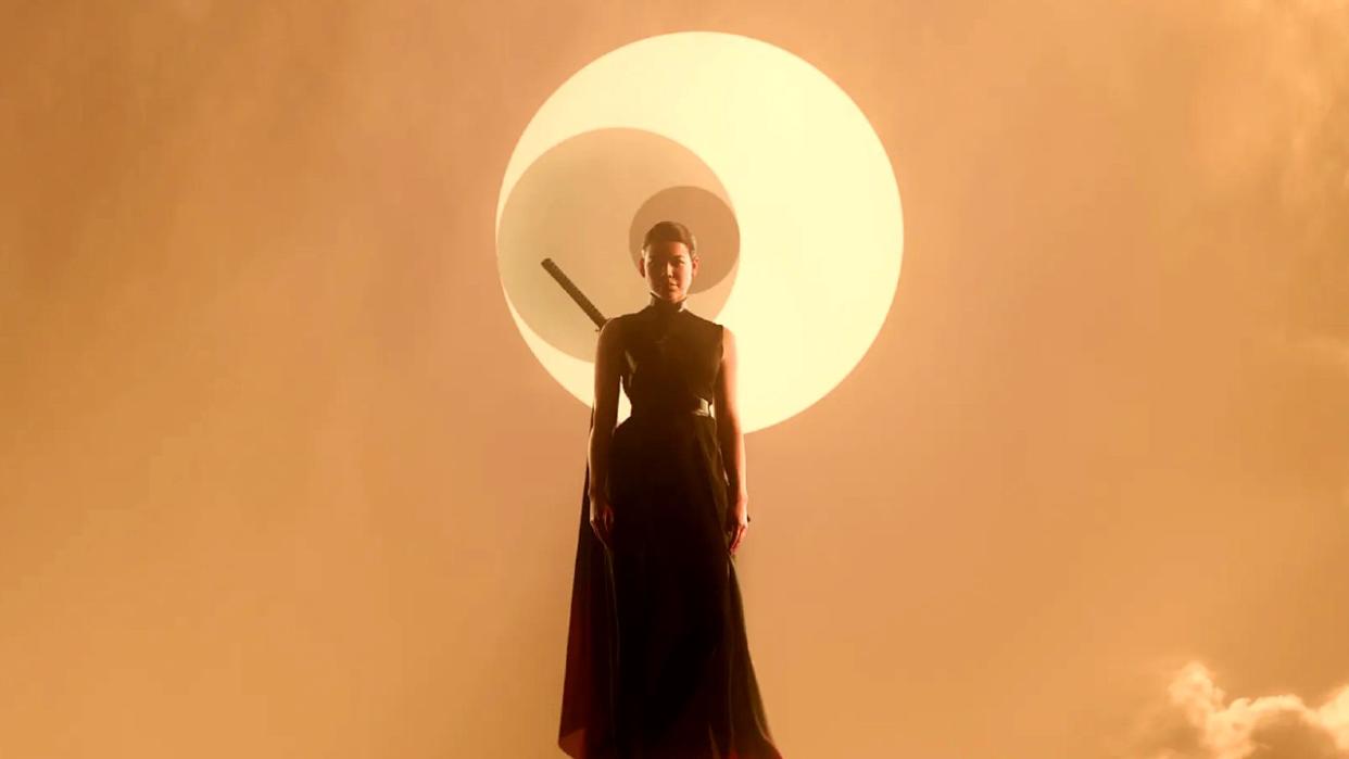  A woman floats in the air in front of a star and two moons. 