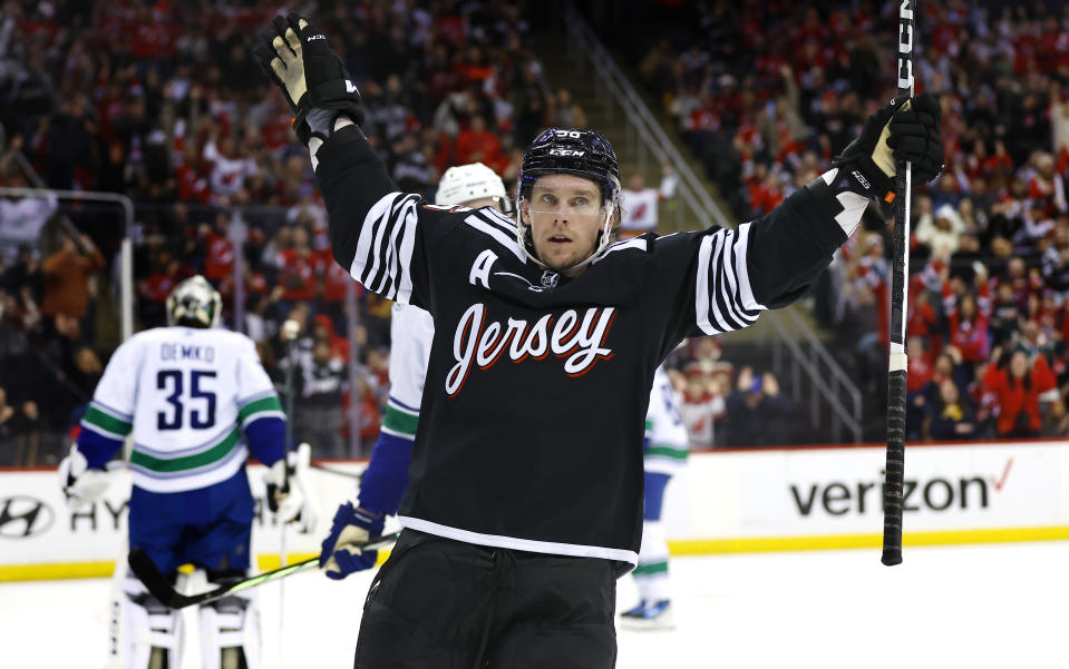 New Jersey Devils left wing Erik Haula (56) reacts after scoring against the Vancouver Canucks during the second period of an NHL hockey game, Saturday, Jan. 6, 2024, in Newark, N.J. (AP Photo/Noah K. Murray)