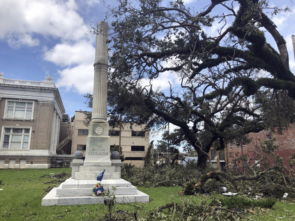 A statue of a Confederate soldier, called the South's Defenders Monument, used to stand on top of this now-empty pedestal in front of a courthouse in Lake Charles, La., Thursday, Aug. 27, 2020. The statue was toppled when Hurricane Laura ripped through the area. Earlier this month parish officials voted to keep the statue in its place. (AP Photo/Melinda Deslatte)