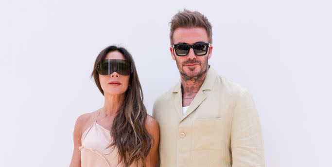 david beckham and victoria beckham pictured wearing sunglasses at a fashion show