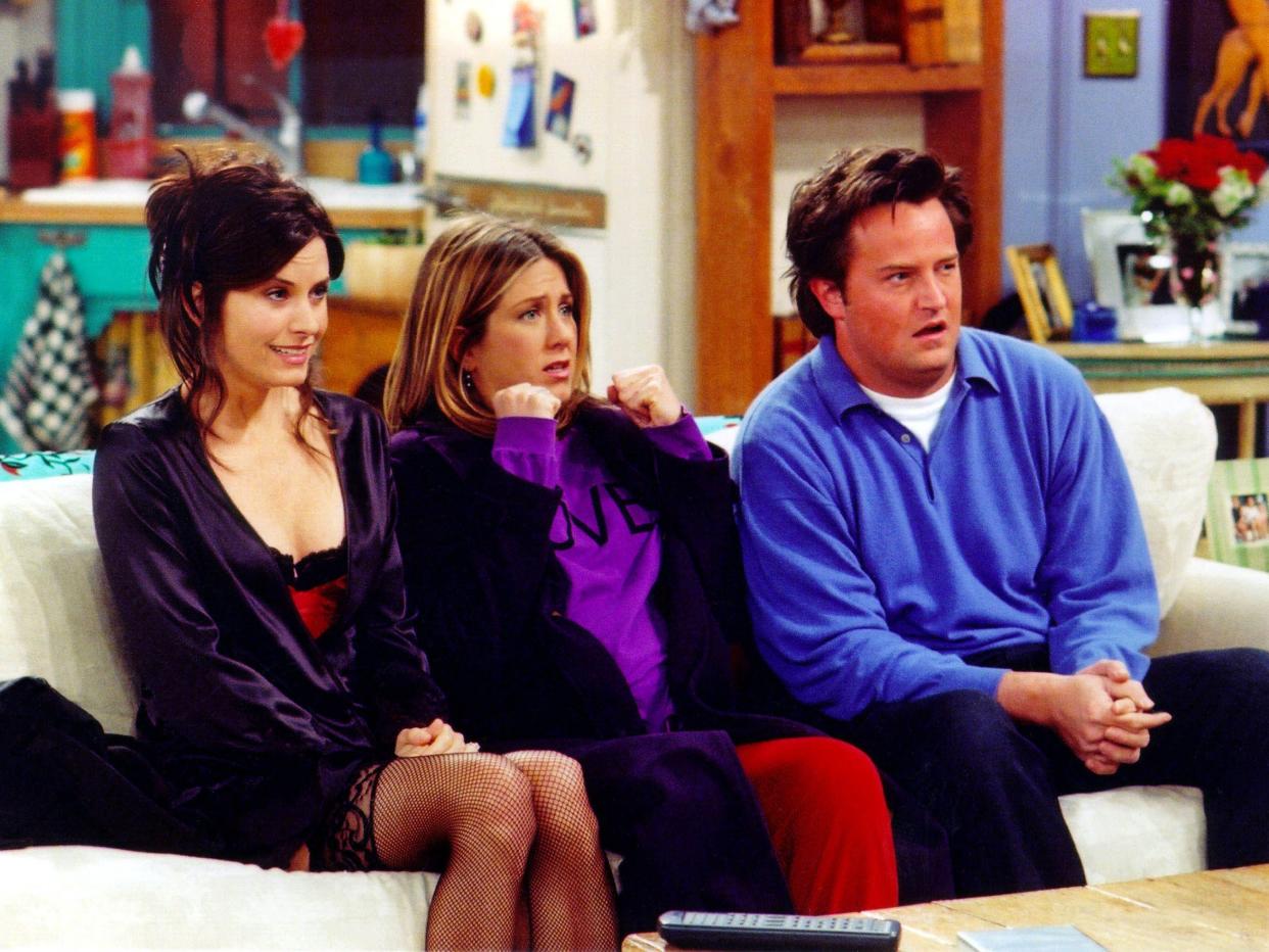 Courteney Cox as Monica, Jennifer Aniston as Rachel, and Matthew Perry as Chandler on "Friends."