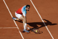 Croatia's Marin Cilic plays a shot against Russia's Andrey Rublev during their quarterfinal match at the French Open tennis tournament in Roland Garros stadium in Paris, France, Wednesday, June 1, 2022. (AP Photo/Jean-Francois Badias)
