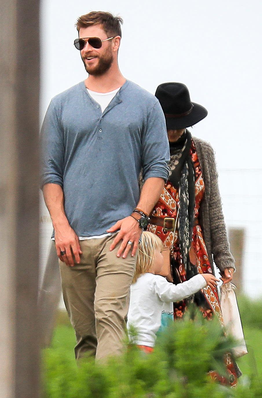 Chris Hemsworth comforts daughter on family day out in Byron Bay