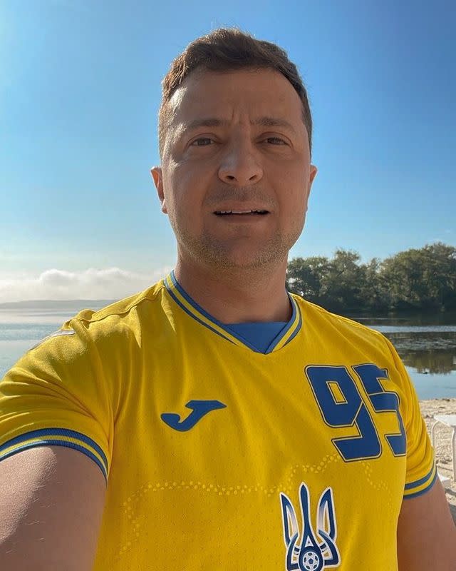 Ukrainian President Volodymyr Zelenskiy poses in Ukraine soccer kit