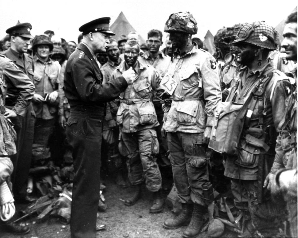 General Dwight D. Eisenhower gives the order of the day, "Full victory - nothing else," to paratroopers somewhere in England, just before they boarded their airplanes to participate in the first assault in the invasion of the continent of Europe, June 6, 1944.
