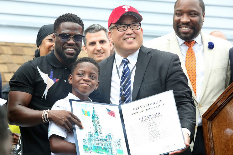 Kevin Hart pictured with son, Hendrix at Kevin Hart Day and birthday celebration and mural dedication in front of Max’s Steaks in Philadelphia, Pa on July 6, 2017