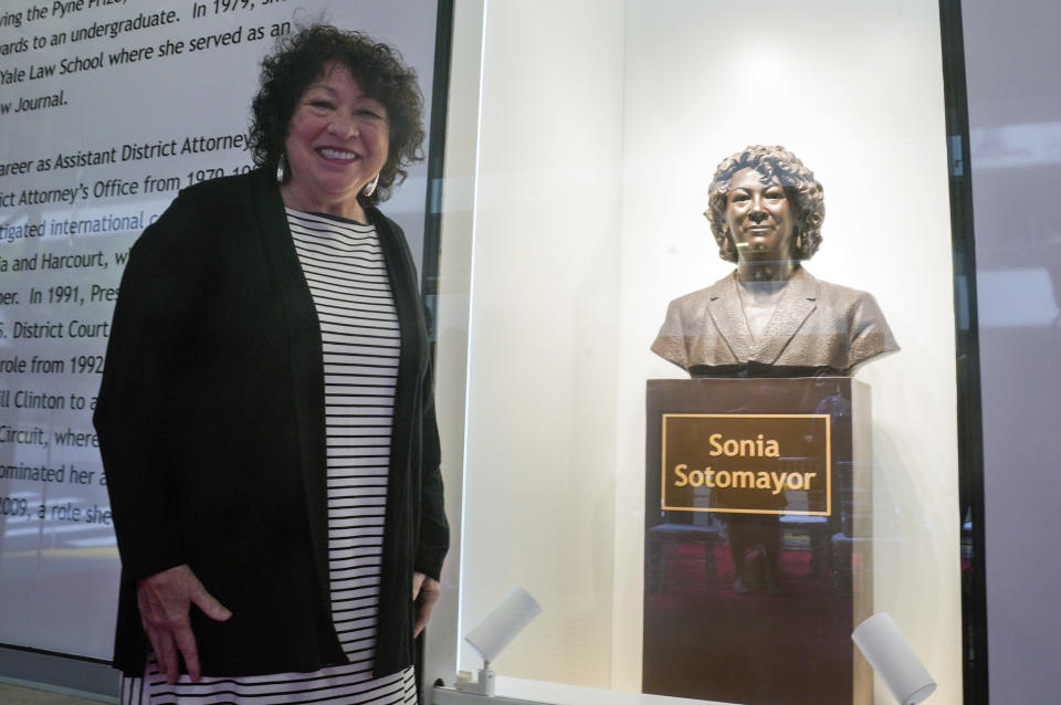 Supreme Court Justice Sonia Sotomayor reviews a statue of herself after its unveiling at Bronx Terminal Market, Thursday, Sept. 8, 2022, in New York. (AP Photo/Bebeto Matthews, Pool)