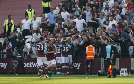 Britain Football Soccer - West Ham United v Swansea City - Premier League - London Stadium - 8/4/17 West Ham United's Cheikhou Kouyate celebrates scoring their first goal with team mates and fans Reuters / Eddie Keogh Livepic