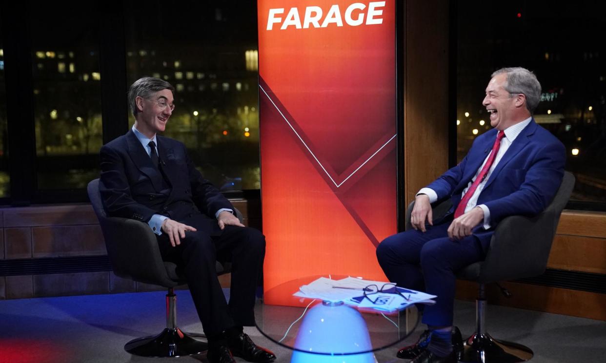 <span>Nigel Farage with Jacob Rees-Mogg on GB News in February 2023. The Reform MP declared that he earned £98,000 a month in his job as a presenter for the channel.</span><span>Photograph: Stefan Rousseau/PA</span>