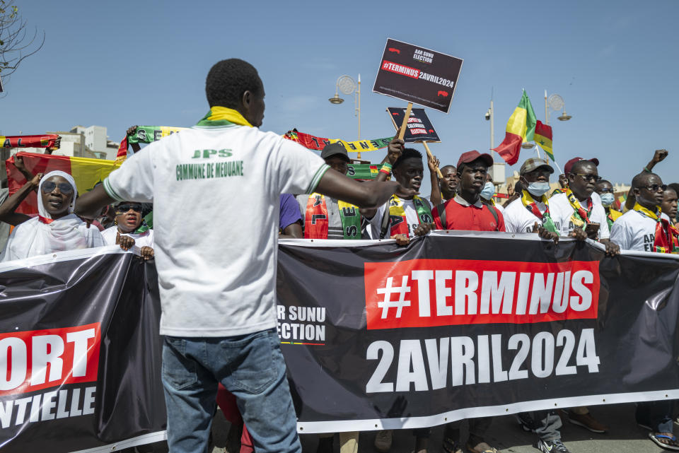 Supporters of the Aar Sunu Senegal opposition collective demonstrate in the streets of Dakar, Saturday, Feb. 17, 2024. Senegal's government says it will hold a presidential election as soon as possible given that the country's top election authority has overturned a decree by President Macky Sall to postpone the vote. (AP Photo/Sylvain Cherkaoui)