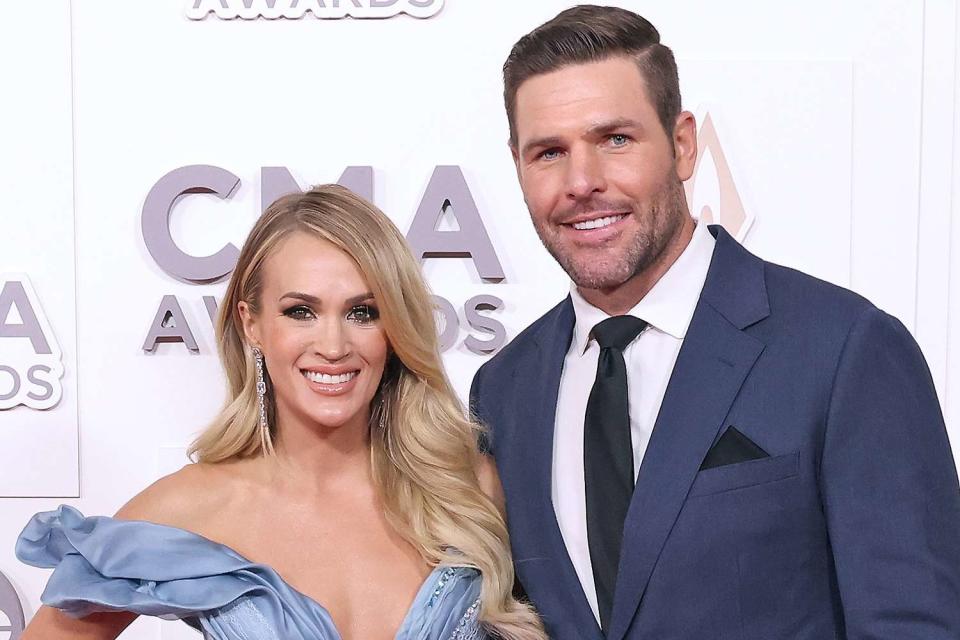 <p>Taylor Hill/FilmMagic</p> Carrie Underwood and Mike Fisher at the CMA Awards in November 2022