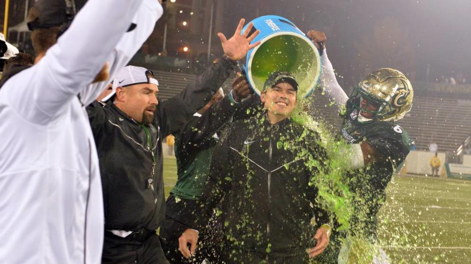Charlotte football coach Will Healy gets a Powerade bath after the team became bowl-eligible for the first time ever, in 2019.