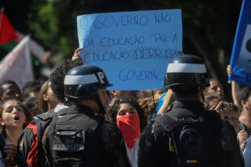 Students protest budget cuts to public education as President Jair Bolsonaro attends an anniversary ceremony at a Rio de Janeiro military school