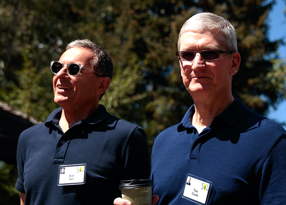 (L to R) Bob Iger, chief executive officer of The Walt Disney Company, walks with Tim Cook, chief executive officer of Apple Inc., as they attend the annual Allen & Company Sun Valley Conference, July 6, 2016 in Sun Valley, Idaho. (Photo by Drew Angerer/Getty Images)