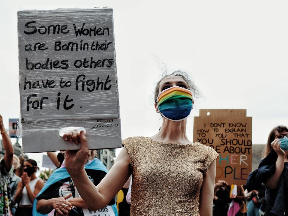 A demonstrator holds up a placard at a Trans Rights protest in London: Angela Christofilou