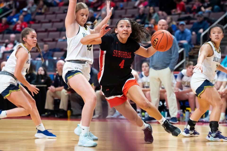 York Suburban's Janay Rissmiller (4) gets to the basket to score on a layup during the District 3 Class 5A girls' basketball championship against Greencastle-Antrim at the Giant Center on March 2, 2023, in Derry Township. The Blue Devils won, 44-30.