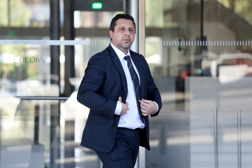 LOS ANGELES, CA - JUNE 25: Richard (cq) Ayvazyan (cq), of Tarzana, convicted of conspiracy, money laundering and other federal crimes for his leading role in a family plot to submit fraudulent applications for emergency government loans to small businesses during the COVID-19 pandemic, exits the Federal Courthouse in downtown on Friday, June 25, 2021 in Los Angeles, CA. Two Armenian immigrant brothers and their wives in the San Fernando Valley accused of stealing $18 million in COVID-19 disaster relief funds by creating an elaborate network of sham small businesses to secure emergency loans by using stolen identities, forged payrolls and fake tax returns. (Gary Coronado / Los Angeles Times)