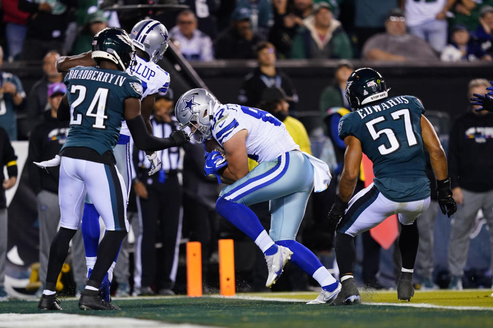 Dallas Cowboys' Jake Ferguson scores a touchdown during the second half of an NFL football game against the Philadelphia Eagles on Sunday, Oct. 16, 2022, in Philadelphia. (AP Photo/Matt Slocum)