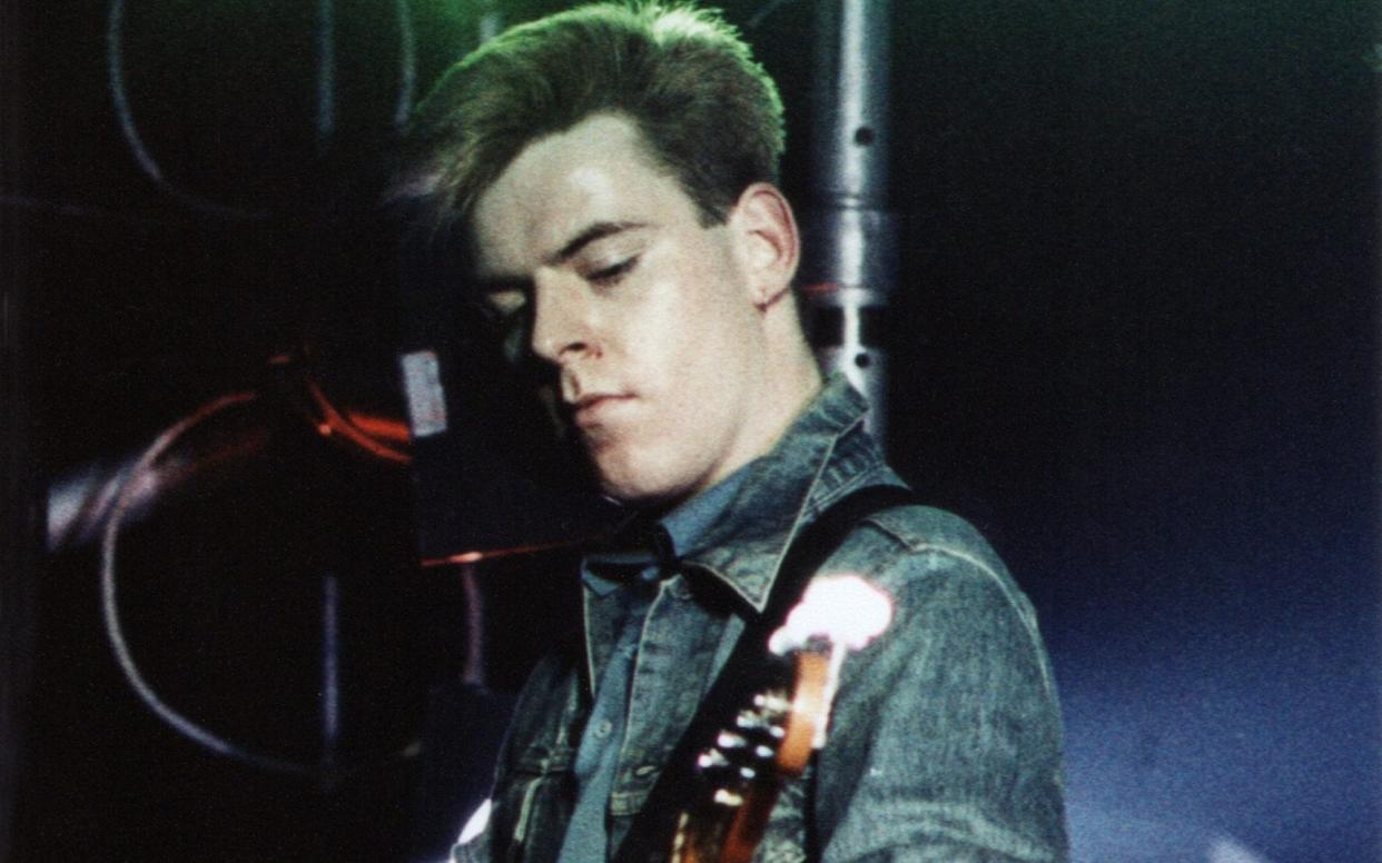 Andy Rourke on stage at Hammersmith Palais in 1984 - Pete Still/Redferns