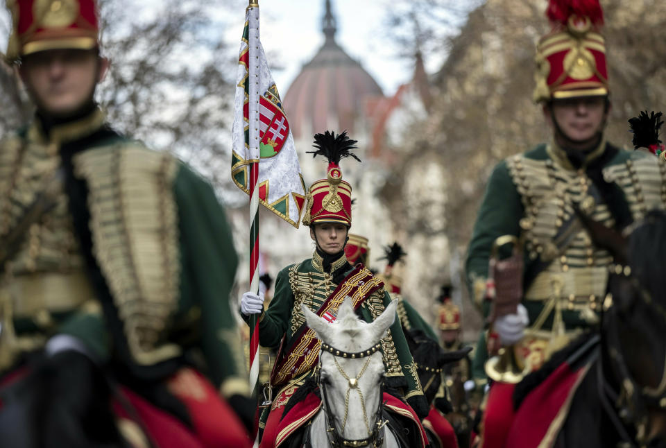 Hussars attend a ceremony during the 171th anniversary celebrations of the outbreak of the 1848 revolution and war of independence against the Habsburg rule in Budapest, Hungary, Friday, March 15, 2019. (Balazs Mohai/MTI via AP)