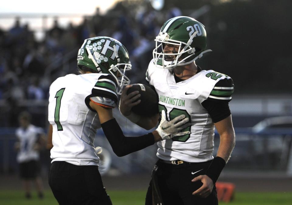 Huntington quarterback Noah Potter (#20) celebrates with wide receiver Gabe Beardsley (#1) after scoring a touchdown during the Huntsmen's 47-12 win over the Southeastern Panthers on Sept. 29, 2023, at Southeastern High School in Chillicothe, Ohio.