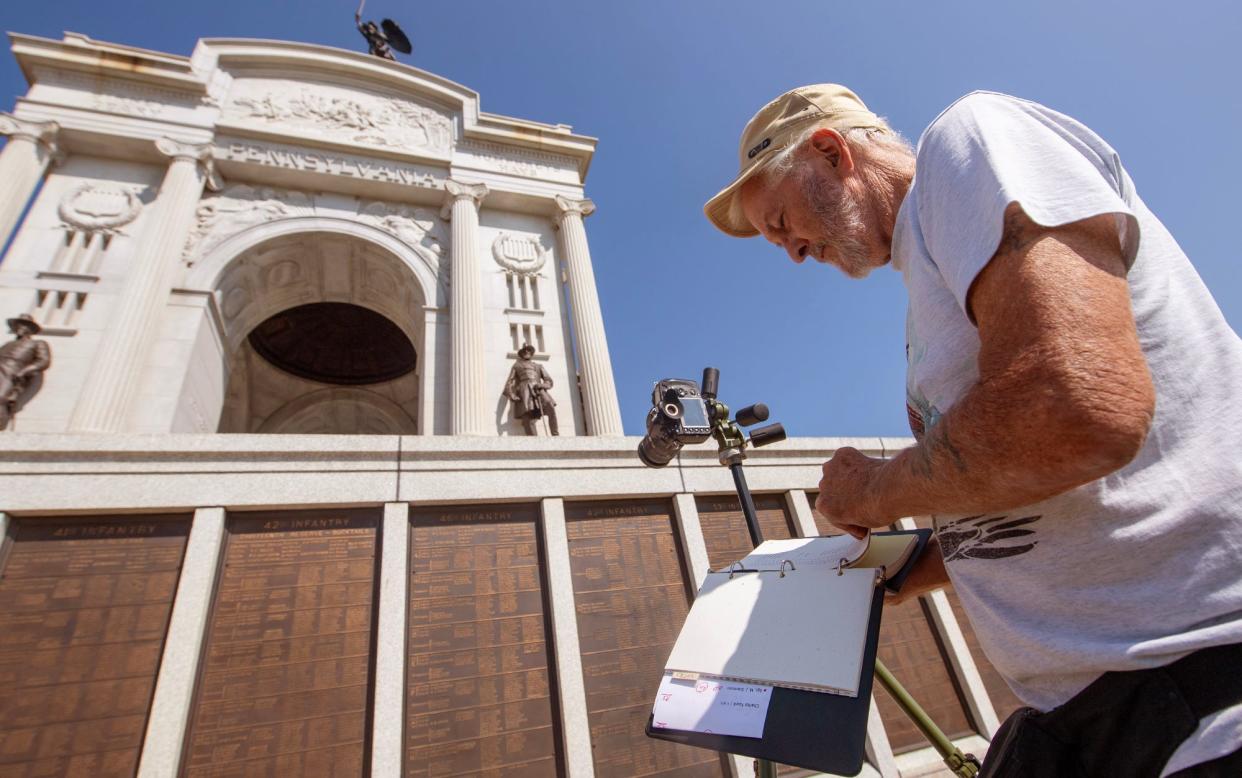 Paul Faust, of Harrisburg, was working on genealogy at the Gettysburg battlefield's Pennsylvania Memorial on Aug. 27, 2024 looking for ancestors who served in the Civil War. Faust said, 'I would never vote for a coward and traitor like Trump. I don’t vote for party. I vote for the person who I think will do the best job.'