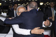 Indian Prime Minister Narendra Modi, left, is embraced by Australian Prime Minster Anthony Albanese as they arrive for an Indian community event in Sydney, Tuesday, May 23, 2023. Modi has arrived in Sydney for his second Australian visit as India's prime minister and told local media he wants closer bilateral defense and security ties as China's influence in the Indo-Pacific region grows. (Wolter Peeters/Pool Photo via AP)