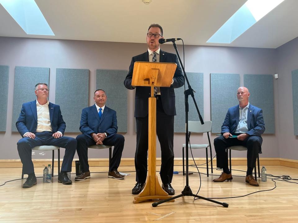 James Aylward addresses the Cardigan Conservative nomination meeting at St. Joachim's Parish Hall in Vernon River on Tuesday as three other men vying for the nomination listen.