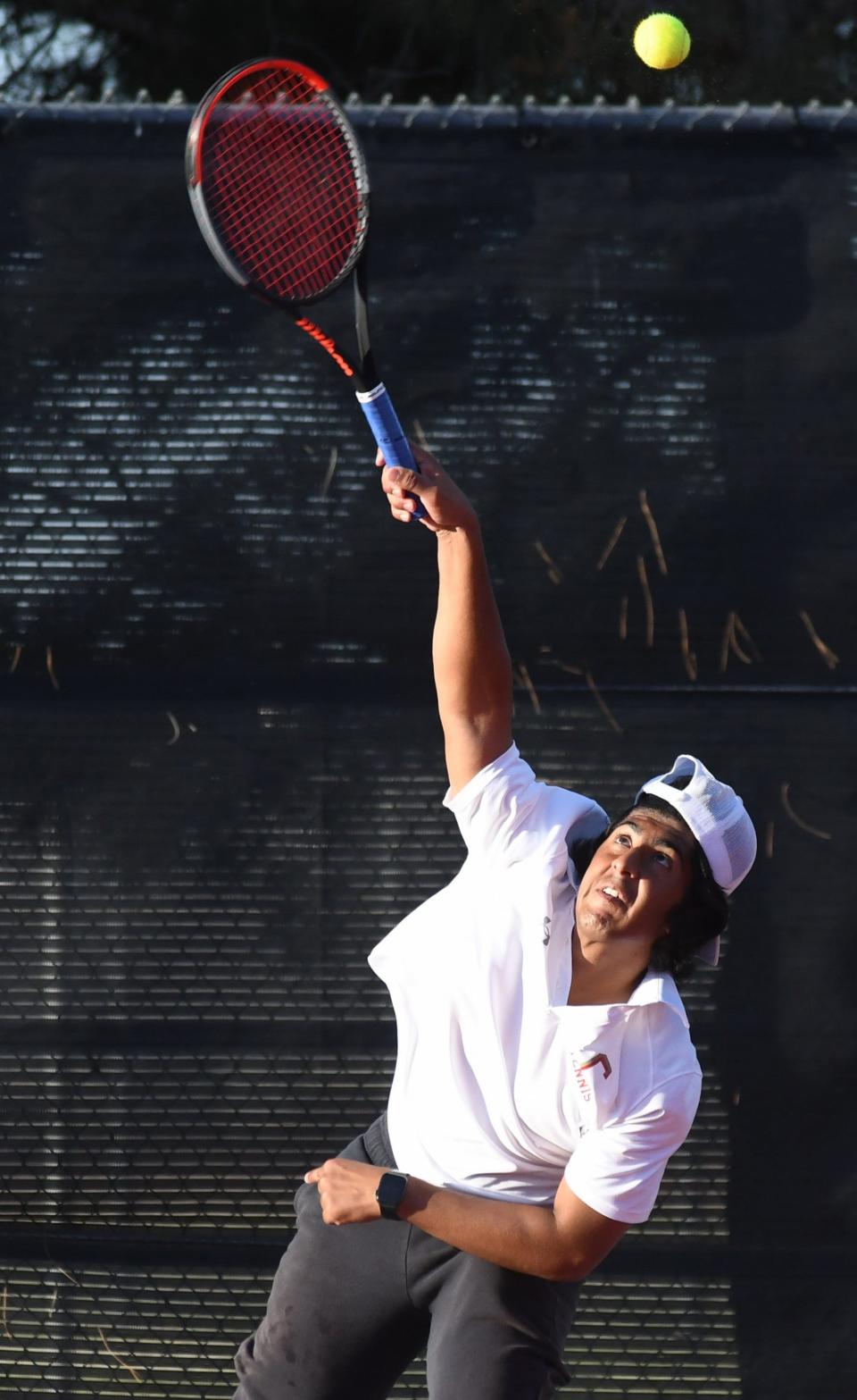 Coronado's Daniel Warraich serves the ball in a boys doubles third-place match at the Region I-5A tennis tournament Tuesday, April 11, 2023, at Texas Tech's McLeod Tennis Center.