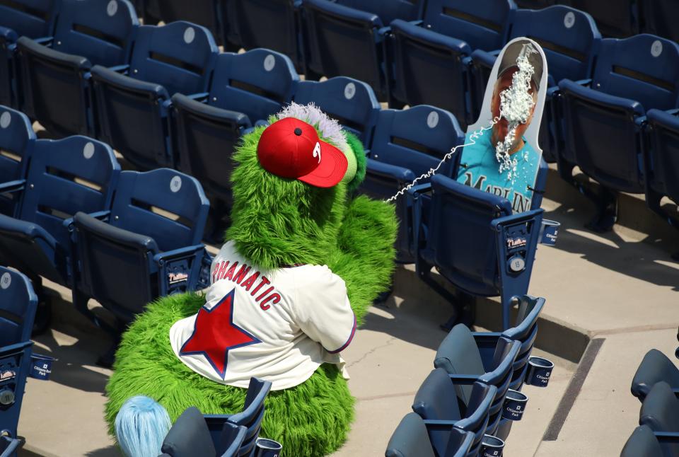 The Phanatic sprays a cardboard cutout of a Marlins' fan with Silly String during a July 26th game.