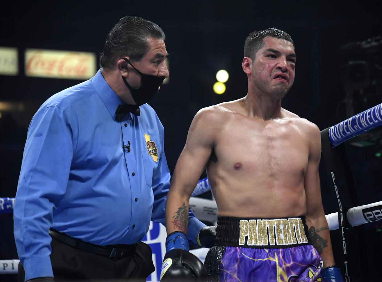 CARSON, CALIFORNIA - MAY 01:  Omar Figueroa Jr. reacts as he heads back to his corner during a sixth round knockout loss to Abel Ramos during a welterweight bout at Dignity Health Sports Park on May 01, 2021 in Carson, California. (Photo by Harry How/Getty Images)