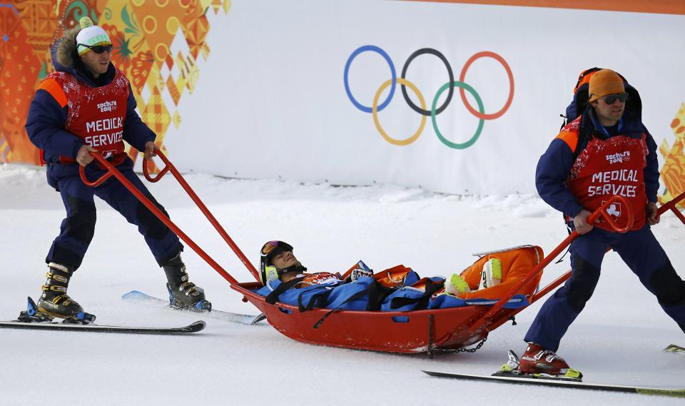 Andorra's Joan Verdu Sanchez is carried away in a stretcher after crashing out during the first run of the men's alpine skiing giant slalom event in the Sochi 2014 Winter Olympics at the Rosa Khutor Alpine Center February 19, 2014. REUTERS/Kai Pfaffenbach (RUSSIA - Tags: OLYMPICS SPORT SKIING)