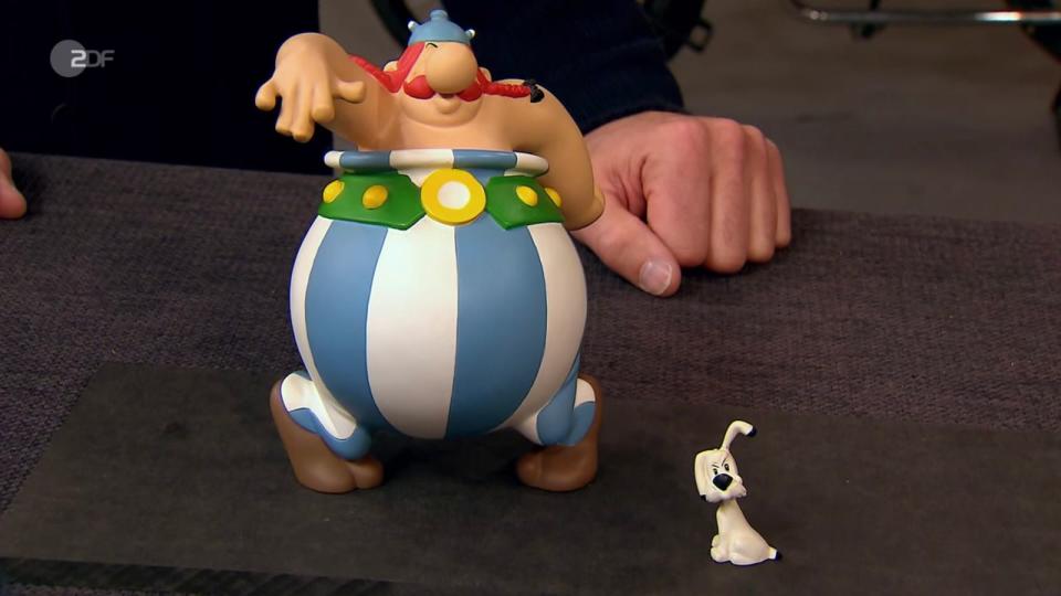 Die handbemalten Figuren "Der tanzende Obelix und der lauschende Idefix" aus Kunstharz waren von 1997 in einer Limitierung von 3.000 Stück produziert worden. Gewünscht wurden nur zehn Euro, doch Experte Kümmel schätzte auf 80 bis 100 Euro. Wolfgang Pauritsch zahlte 120 Euro. (Bild: ZDF)