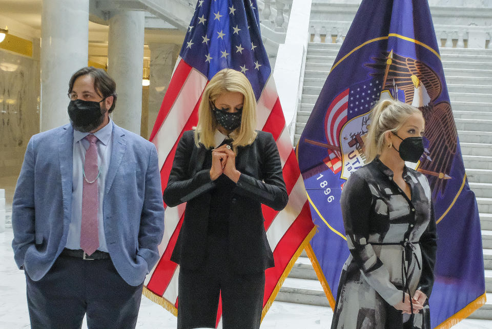 Paris Hilton, center, who has spoken out about the abuses she said she experienced at Provo Canyon School, center, was an advocate for the passage of SB127 along with fellow activists Jeff Netto, who spoke to Utah legislators and Caroline Lorson, with the advocacy group Breaking Code Silence. Activists and supporters gathered in the Capitol rotunda in Salt Lake City, Tuesday, April 6, 2021, for a ceremonial bill signing of SB127 that will bring more oversight to the state's so-called troubled-teen industry. (Leah Hogsten/The Salt Lake Tribune via AP)