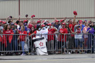 Supporters wave as they wait for admission to attend a campaign event for President Donald Trump at the Arnold Palmer Regional Airport, Thursday, Sept. 3, 2020, in Latrobe, Pa. (AP Photo/Keith Srakocic)