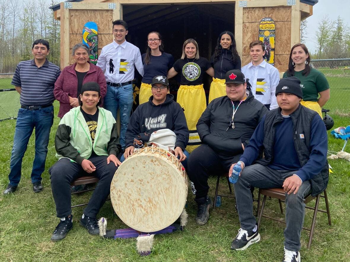 The University of Alberta team presented elders with tobacco at a smudging ceremony, which was followed by a drum ceremony performed by the Young, Wild and Cree drummers.  (Submitted by Taylor McPherson - image credit)