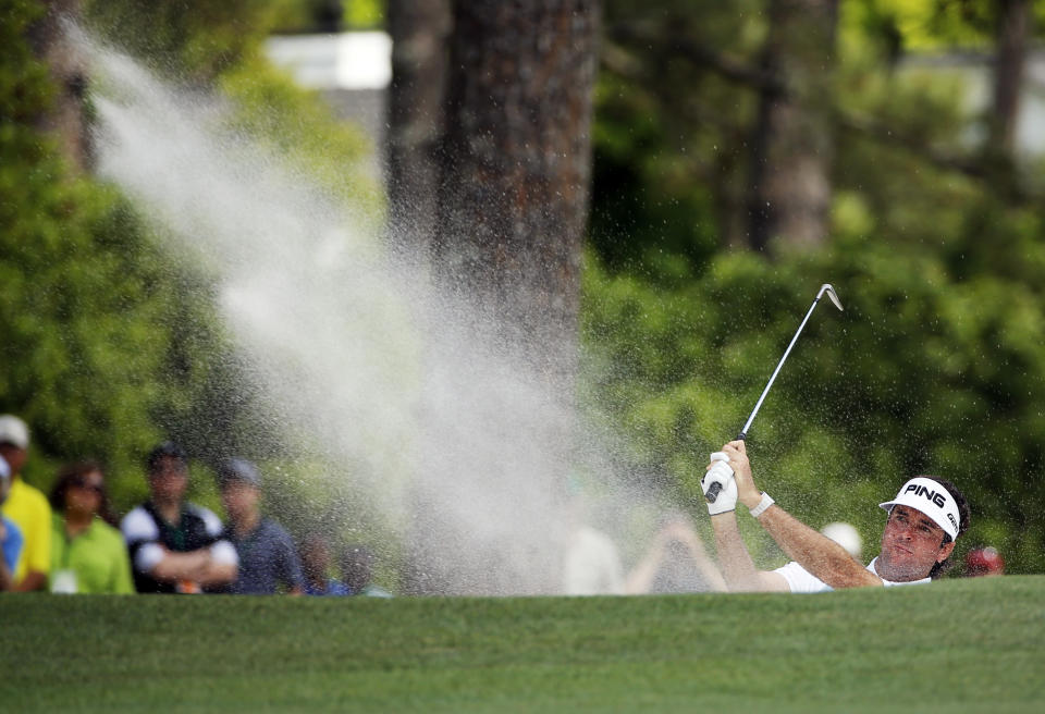 Bubba Watson hits out of a bunker on the first fairway during the fourth round of the Masters golf tournament Sunday, April 13, 2014, in Augusta, Ga. (AP Photo/David J. Phillip)