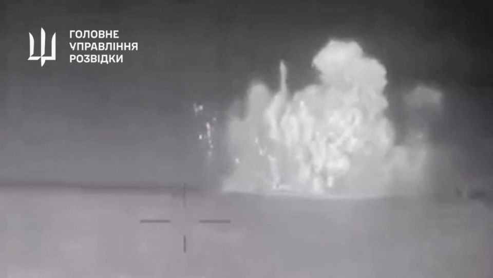 Ukrainian Defence Ministry footage shows the Russian ship being hit by sea drones off the Crimean coast (via REUTERS)