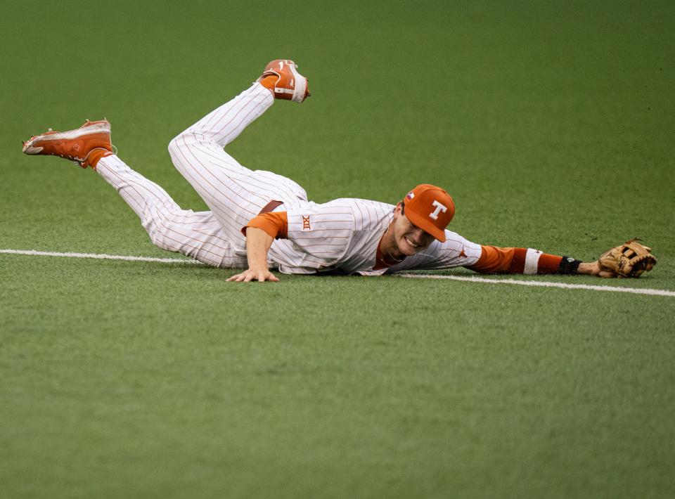 Texas outfielder Will Gasparin dives for a ball in the third inning of the Longhorns' 5-4 win over Kansas on Thursday. Game 2 of their series is at 6:30 p.m. Friday at UFCU Disch-Falk Field. This is the Longhorns' final series of the regular season.